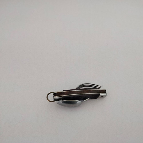 Vintage pocket knife with integrated fork and spoon, used