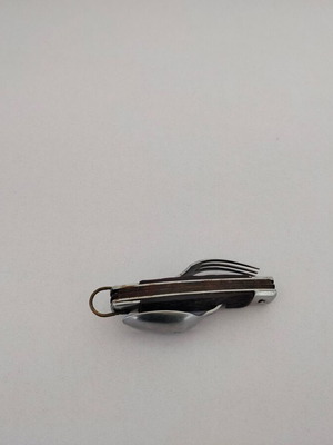 Vintage pocket knife with integrated fork and spoon, used