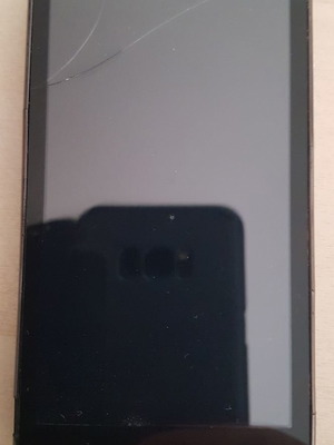 Turbo-X G400 smartphone with broken screen, functional without battery and charger