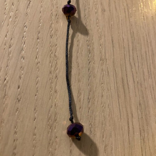 Necklace with purple beads like new, long with black cord