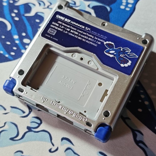 Silver Gameboy Advance SP shell with embossed Kyogre UV print
