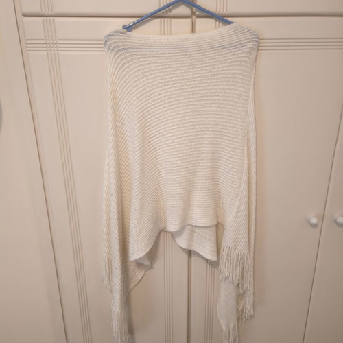 Beige knitted poncho with fringes, size Small