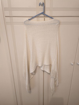Beige knitted poncho with fringes, size Small