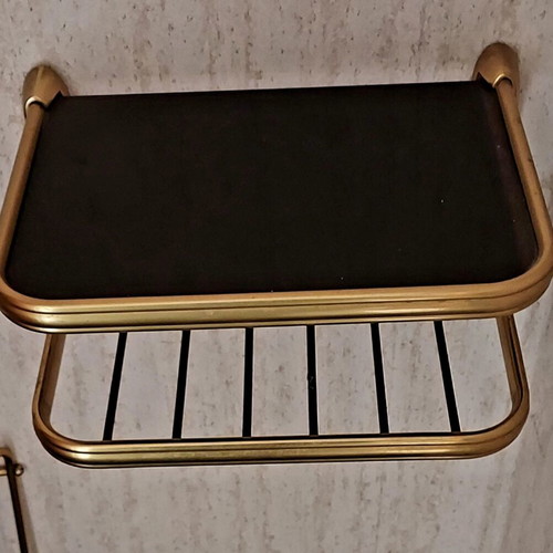 Vintage hanging wall shelf used with black glass and brass