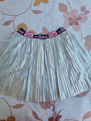 Girls' silver pleated skirt like new, age 10