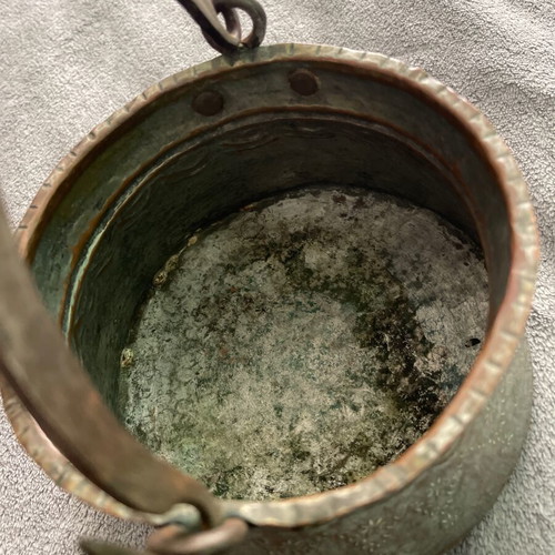 Handmade copper cauldron used with hammered texture and designs
