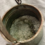 Handmade copper cauldron used with hammered texture and designs