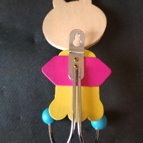Children's wall hanger like new with metal base and wooden decorations
