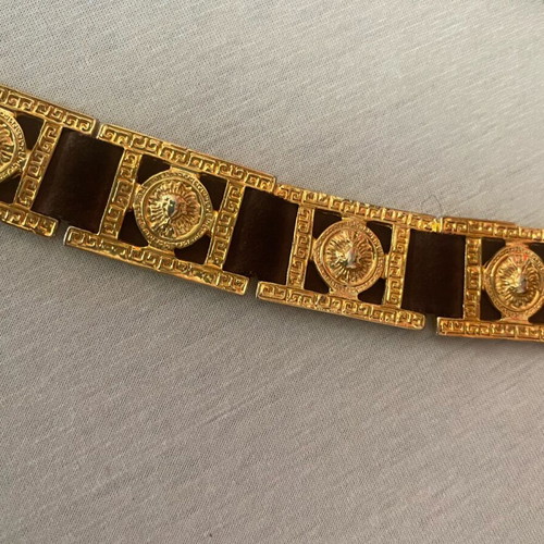 Belt with golden metal details on brown leather, like new