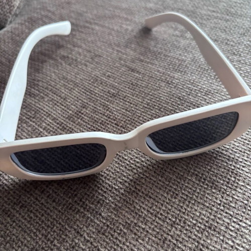 Sunglasses used with beige frame