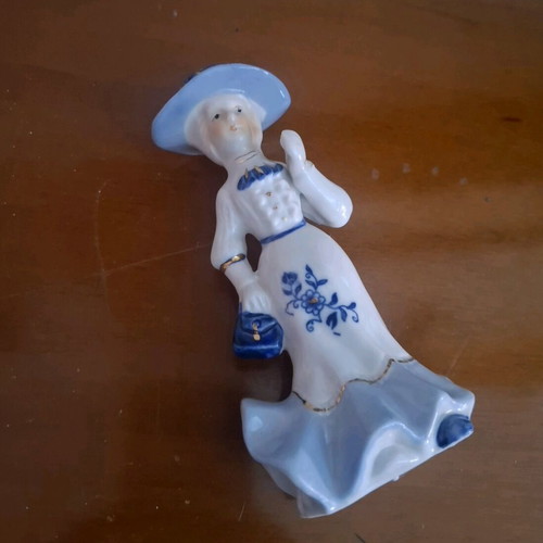 Retro porcelain woman figurine with gold details like new