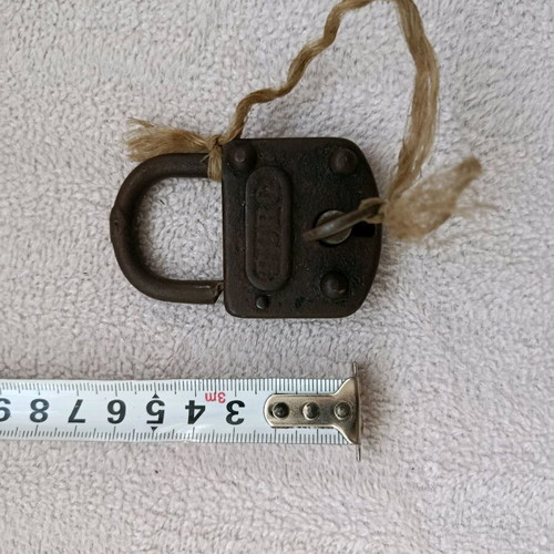 Old padlock with key used, does not unlock or lock
