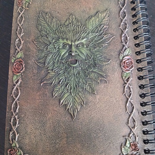 Iron notebook like new with embossed designs and magnet