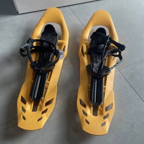 Sneka snowshoes used for hiking with metal crampons