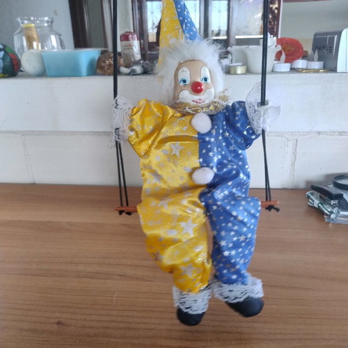 Ceramic clown harlequin acrobat doll on swing like new