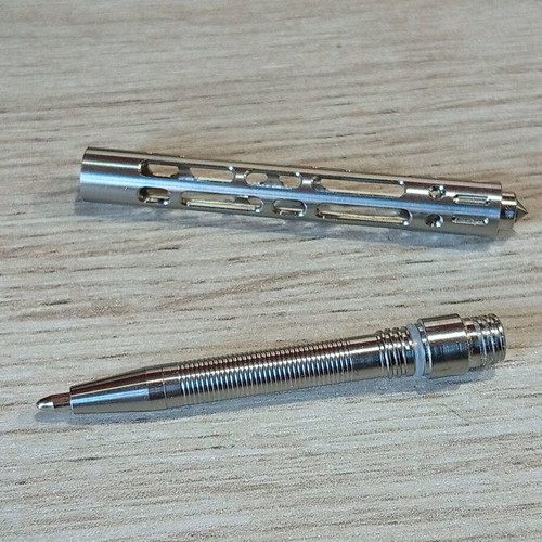 Mini tactical pen with titanium frame like new