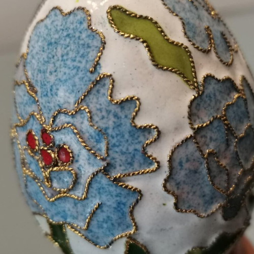 Cloisonne egg used with blue flowers and wooden base