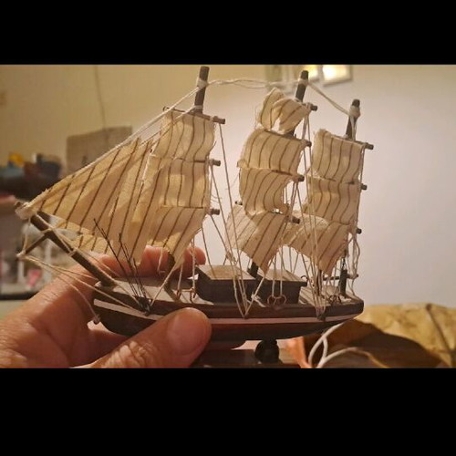 Small decorative sailboat with sails used