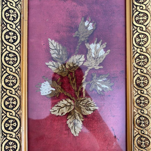 Vintage embroidery framed on velvet