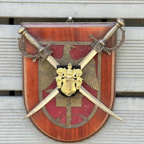 Military crest with crossed swords and eagle on wooden base used
