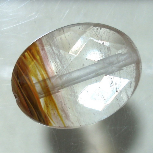 Quartz mineral with oxide inclusions like new, 14.70ct, with hole