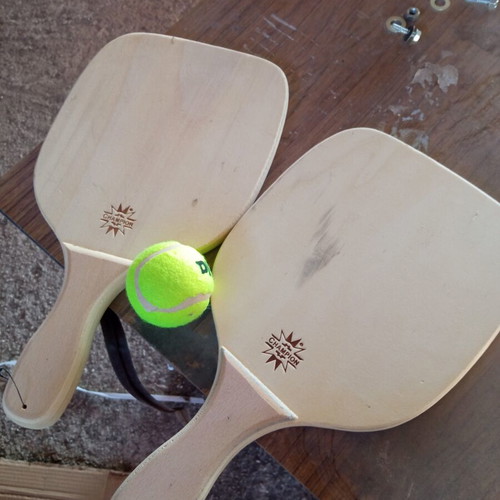 Wooden rackets with ball used, minor imperfections