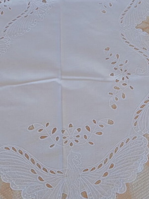 Embroidered square table linen with machine embroidery