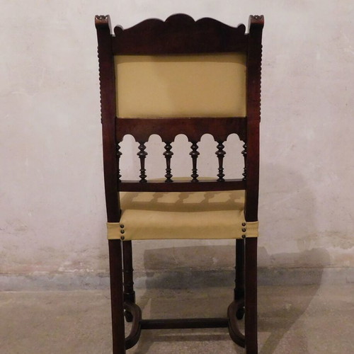 Wood-carved chair with leather seat like new, about 100 years old