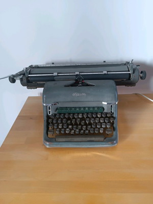 Olympia typewriter used, not working, iron body