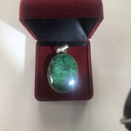 Necklace of smelted emerald like new with black ribbon