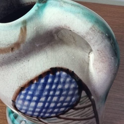 Ceramic owl pitcher used, broken and glued on the beak