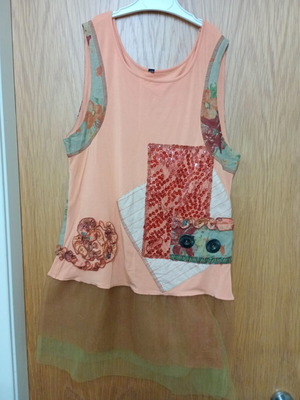 Sleeveless top with sequins and decorative buttons, orange