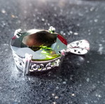 Pendant with green lab topaz in silver-plated base like new