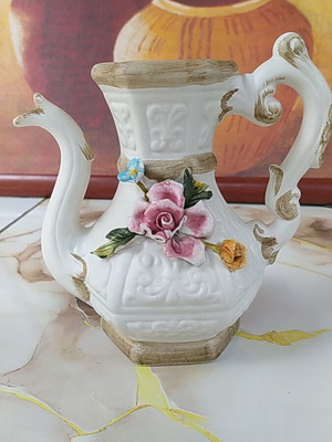 Ceramic decorative pitcher used with colorful flowers