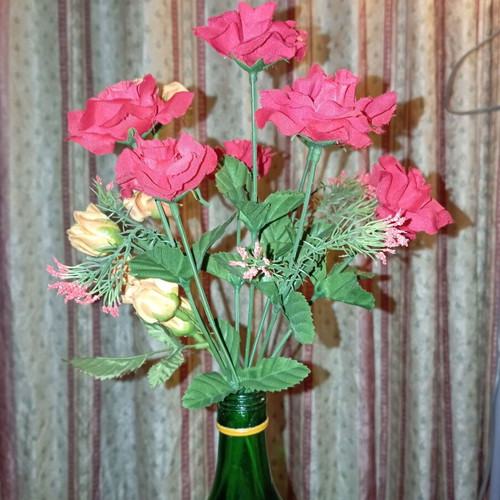 Bouquet of red artificial roses like new for decoration