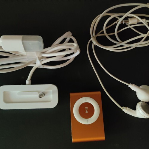 Apple iPod Shuffle 2nd Gen orange with dock, cable and headphones used