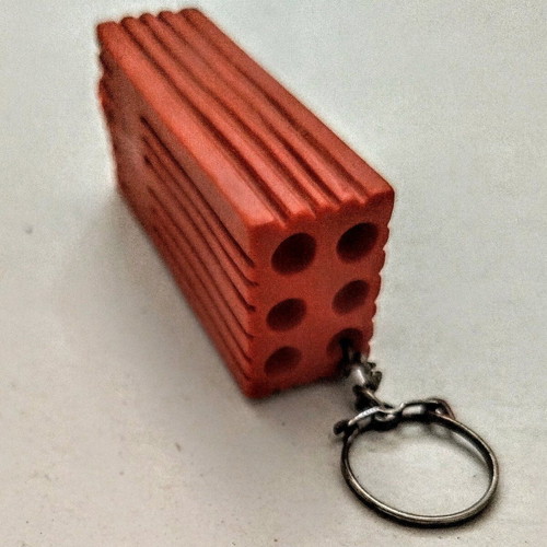 Happy Brick keychain like new, soft and lightweight