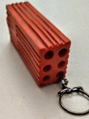 Happy Brick keychain like new, soft and lightweight