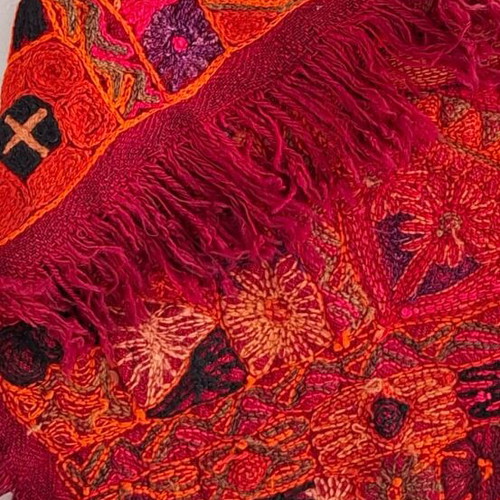 Handmade woven cover like new in red shades