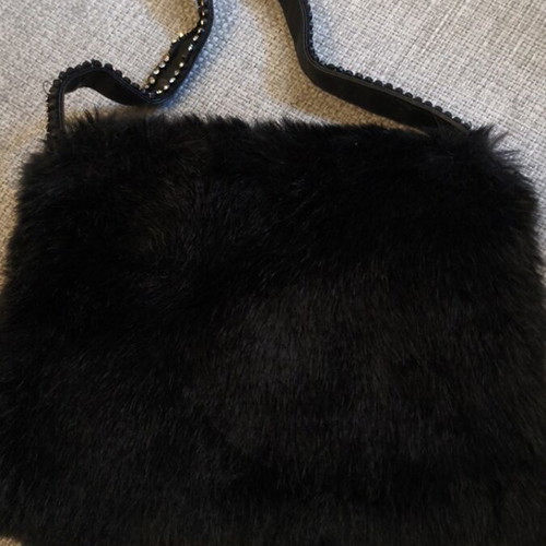 Fur bag like new, black, with zipper and strap with rhinestones