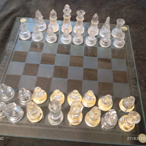 Glass chessboard used, missing one rook