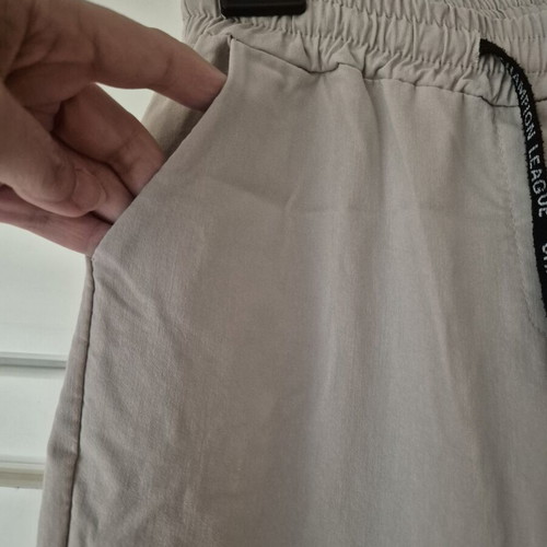 Beige elastic pants size L like new with side pockets and drawstring waist