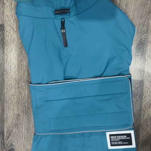 Waterproof dog jacket like new with fleece lining in petrol color