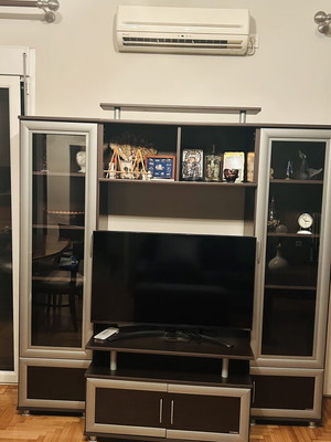 Living room unit like new with glass cabinets and TV space