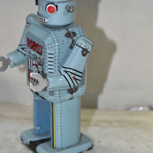 Vintage tin wind-up robot used, blue color