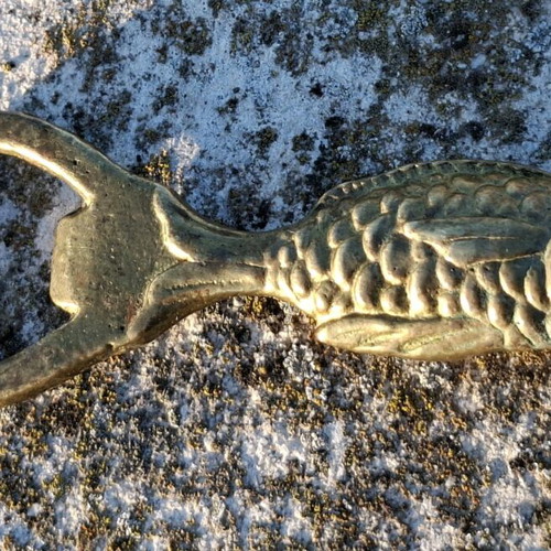 Vintage brass fish-shaped bottle opener used