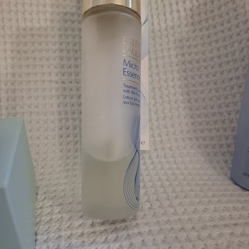 Estée Lauder cosmetic jars with Micro Essence lotion used set