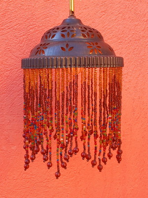 Wall light with beaded fringe