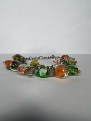 Bracelet used with multicolored green and orange beads