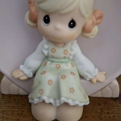 Precious Moments collectible miniature girl in heart like new